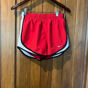 Red Nike shorts